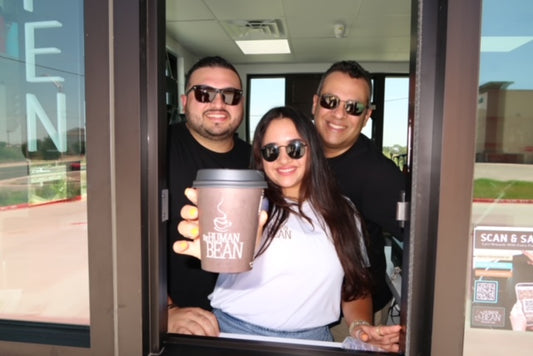 The Human Bean Store Team Handing out Cup of Coffee